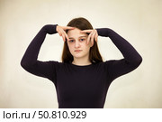 Teen Actress Expresses a Wide Range of Emotions in an Artistic Indoor Setting. Стоковое фото, фотограф Aleksandr Golubev / Фотобанк Лори
