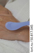 A special cooling gel is applied to the young woman's hand prior to starting the hardware photoepilation procedure. Close up. Стоковое видео, видеограф Strunov David / Фотобанк Лори