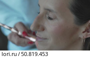 Makeup Brush Woman, Prepping: Artist applies foundation in studio before event for flawless complexion. Стоковое видео, видеограф svetograph / Фотобанк Лори