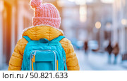 Back to School: A young child with a backpack heading towards the unknown, full of anticipation, eagerness, and a hint of apprehension. Стоковое AI-изображение, AI-художник Данила Большаков / Фотобанк Лори