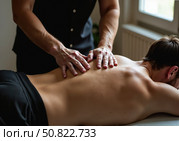 Врач-массажист делает проводит сеанс лечебного массажа. A massage therapist performs a therapeutic massage session. Стоковое AI-изображение, AI-художник Смирнова Светлана / Фотобанк Лори