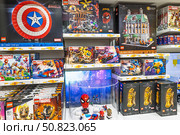 LEGO Marvel shelves with Captain America shield, Spider Man and Avengers. London, UK, 2 June 2024. Редакционное фото, фотограф Zydrius Tartenis / Фотобанк Лори