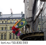 A row of flags from different countries are hanging from a building. Стоковое фото, фотограф Ярославский Максим / Фотобанк Лори