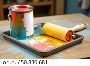 There is a can of paint on the table, there is a tray with a roller in the paint. Стоковое AI-изображение, AI-художник Галина Эмберг / Фотобанк Лори