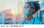 Hopeful Guardian: A Frontline Healthcare Worker in Protective Gear Stands Against a Bright Horizon. Стоковое AI-видео, аниматор Данила Большаков / Фотобанк Лори