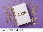 Empty notebook 2026. Purple color background. Blank Greeting Card, Invitation. Minimal Flier Design. Back to life, goal list concept. Resolutions, plan, goals, checklist idea. Top view. New Year. Стоковое AI-изображение, AI-художник Марина Демидюк / Фотобанк Лори