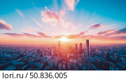 Cityscape Sunrise: A vibrant urban sprawl bathed in warm, optimistic light, ideal for showcasing urban beauty and hope. Стоковое AI-изображение, AI-художник Данила Большаков / Фотобанк Лори