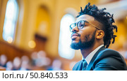 Contemplation in the Church: Portrait of a Young Man Seeking Spiritual Insight. Стоковое AI-изображение, AI-художник Данила Большаков / Фотобанк Лори