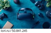 High-Tech Immersion: Display of VR headset with gaming elements, perfect for virtual reality technology presentation and gaming promotional materials. Стоковое AI-изображение, AI-художник Данила Большаков / Фотобанк Лори