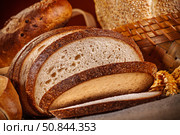 Fresh baked bread. Assorted bakery products loafs of bread and rolls... Стоковое фото, фотограф Андрей Армягов / Фотобанк Лори