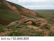 Fancy stones on the slopes of the highest point of the Caspian lowland - Bolshoe Bogdo Mountains on a summer day, Bogdinsko-Baskunchak Nature Reserve, Akhtubinsky district, Astrakhan region, Russia. Стоковое фото, фотограф Ula Ulachka / Фотобанк Лори