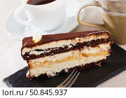 Piece of chocolate lemon cake on black board. Стоковое фото, фотограф Яков Филимонов / Фотобанк Лори