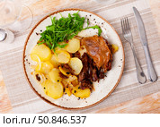 French dish duck confit with arugula on table. Стоковое фото, фотограф Яков Филимонов / Фотобанк Лори