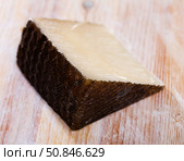 Spanish tasty sheep cheese Manchego on wooden surface. Стоковое фото, фотограф Яков Филимонов / Фотобанк Лори