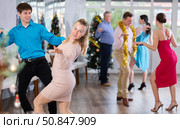 Incendiary paso doble dance during Christmas or New Year celebrations in dance studio. Стоковое фото, фотограф Яков Филимонов / Фотобанк Лори