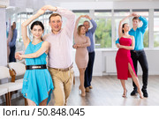 Woman and man learning to dance Vienneze waltz in dancing class. Стоковое фото, фотограф Яков Филимонов / Фотобанк Лори