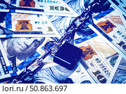 Dollar bills, black lock and metal chain. Money lock or security concept. Account lockout. Стоковое фото, фотограф Емельянов Евгений Викторович / Фотобанк Лори