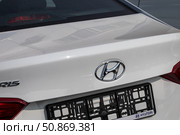 Russia, Kaluga - SEPTEMBER 29, 2020: Chrome-plated Hyundai logo on the trunk of a new car. Редакционное фото, фотограф Емельянов Евгений Викторович / Фотобанк Лори