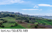 Beautiful countryside landscape showcasing a Tuscan village under a bright blue sky (2015 год). Стоковое фото, фотограф Татьяна  Бральнина / Фотобанк Лори