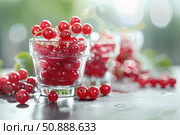 Fresh redcurrants overflowing glass bowls on table. Стоковое AI-изображение, AI-художник Иван Рябоконь / Фотобанк Лори