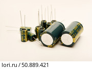 Electrolytic capacitors of different nominal values. Energy storage devices. Electronic radio elements. Стоковое фото, фотограф Valeriy Lushchikov / Фотобанк Лори