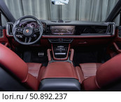 Novosibirsk, Russia -  July 14, 2025: Porsche Cayenne,  Prestige car interior with dashboard, steering wheel, speedometer and tachometer. Редакционное фото, фотограф Виталий Сова / Фотобанк Лори