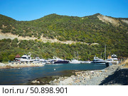 Utrish, Russia - September 07, 2022: Port and parking for yachts and ships. Редакционное фото, фотограф Наталия Кирсанова / Фотобанк Лори