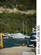 Utrish, Russia - September 07, 2022: Port and parking for yachts and ships. Редакционное фото, фотограф Наталия Кирсанова / Фотобанк Лори