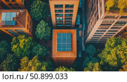 Aerial survey of modern urban structures with rooftop solar installations nestled among vibrant green trees. Стоковое AI-видео, аниматор Данила Большаков / Фотобанк Лори