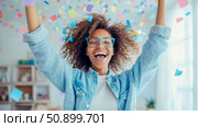 Celebration: Joyful woman in confetti shower, design for a greeting card or promotion. Стоковое AI-изображение, AI-художник Данила Большаков / Фотобанк Лори