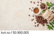 Morning Brew Delight: Aromatic Coffee Beans and Fresh Green Leaves Composition. Стоковое AI-изображение, AI-художник Данила Большаков / Фотобанк Лори
