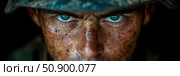 Close-up portrait of a battle-worn combatant's intense gaze: a symbol of resilience, strength, and unwavering determination. Стоковое AI-изображение, AI-художник Данила Большаков / Фотобанк Лори