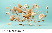 Nutritional still life composition of almonds and nougat in levitation on a light blue background, for culinary recipes, product presentation or conceptual snack illustration. Стоковое AI-изображение, AI-художник Данила Большаков / Фотобанк Лори