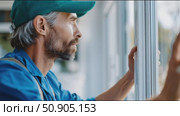 Thoughtful man gazes out of a window while reflecting in a modern workspace. Стоковое AI-видео, аниматор Сергей Толмачёв / Фотобанк Лори