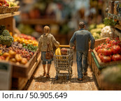 Маленькие фигурки человечков мужчины и женщины идут в продуктовом магазине покупать овощи. Small figurines of a man and a woman are walking to a grocery store to buy vegetables. Стоковое AI-изображение, AI-художник Смирнова Светлана / Фотобанк Лори