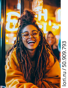 Portrait of a Woman with dreadlocks, glasses and a vibrant, genuine smile, radiating joy in a warm, luminous setting. Стоковое AI-изображение, AI-художник Данила Большаков / Фотобанк Лори