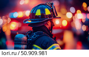 Brave Firefighter in Action: A Symbol of Courage and Service at Night. Стоковое AI-изображение, AI-художник Данила Большаков / Фотобанк Лори