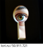 A captivating eye peers through a keyhole, revealing vibrant hues and intricate details. This intriguing moment invites imagination, evoking curiosity about what lies beyond Generative AI. Стоковое AI-изображение, AI-художник Юлия Петровская / Фотобанк Лори