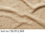 Beige linen fabric background with wrinkles and folds. Natural light brown textile texture for design, and rustic style concepts. Стоковое AI-изображение, AI-художник Павел Муравьев / Фотобанк Лори