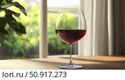 tasting wine glass at home ai generated. Стоковое AI-изображение, AI-художник Vectorwin / Фотобанк Лори