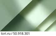 Light and shadow play on green surfaces inside a modern architectural space. Стоковое AI-изображение, AI-художник Сергей Толмачёв / Фотобанк Лори