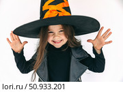 Portrait of funny little girl in a witch costume, on a white background. Halloween party concept. trick or treat. High quality photo. Стоковое фото, фотограф Ирина Михайличенко / Фотобанк Лори