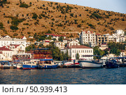 Balaklava, Crimea, 21 Jule 2020, Boats in port of seaside city on Black Sea. Редакционное фото, фотограф Spirit River / Фотобанк Лори