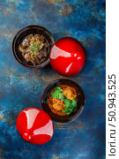 Chicken and liver dishes cooked in tagine. Traditional way of cooking food in Arab countries. Стоковое фото, фотограф Ирина Буракова / Фотобанк Лори