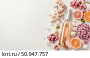 Elegant Wine Pairing Composition Featuring Rose Wine, Fresh Grapes, Citrus, and Gourmet Snacks, a Flat Lay for Culinary and Lifestyle Marketing. Стоковое AI-изображение, AI-художник Данила Большаков / Фотобанк Лори