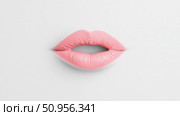 Softly parted pink lips with a matte cosmetic finish, a clean minimalist representation for beauty product advertisement, card, or poster art. Стоковое AI-изображение, AI-художник Данила Большаков / Фотобанк Лори