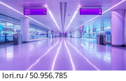 Expansive Modern Airport Concourse Hallway Bathed in Radiant Purple and Blue Illumination, Featuring Polished Floor Reflections, Perfect for Travel and Future Concepts. Стоковое AI-изображение, AI-художник Данила Большаков / Фотобанк Лори
