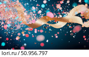 A vibrant explosion of golden glitter and shimmering confetti with festive bokeh lights on a deep blue hue, ideal for celebration banners. Стоковое AI-изображение, AI-художник Данила Большаков / Фотобанк Лори