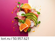 A deconstructed avocado salad is set against a dual-tone backdrop, blending pastel and deep shades. This artistic presentation highlights the contrast and creativity in modern culinary arts. Стоковое AI-изображение, AI-художник Nart / Фотобанк Лори