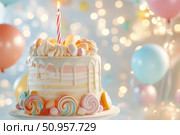 A two-tiered birthday cake is adorned with pastel frosting and vibrant candy embellishments. The colorful lollipops and marshmallow accents create a whimsical and celebratory dessert centerpiece. Стоковое AI-изображение, AI-художник Nart / Фотобанк Лори